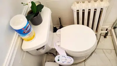 a white toilet sitting in a bathroom with aillin at Modern 3BR Apartment Downtown HarborPt I-95 Train in Stamford