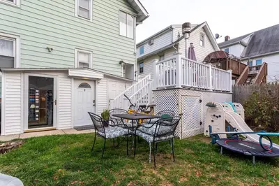 a backyard with a table and a play set at Sunshine Room by harbor downtown beach I-95&Train in Stamford