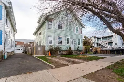 a blue house with a driveway in front of it at Sunshine Room by harbor downtown beach I-95&Train in Stamford