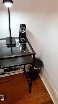 a glass table with a speaker and a lamp on it at The Blue Sapphire 2BR 2 King beds & ample backyard in Bridgeport