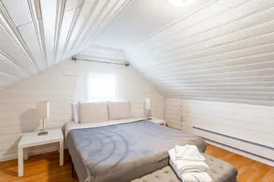 a bedroom with a large bed and a window at The B&W Haven 3BR private office by LI Ferry in Bridgeport