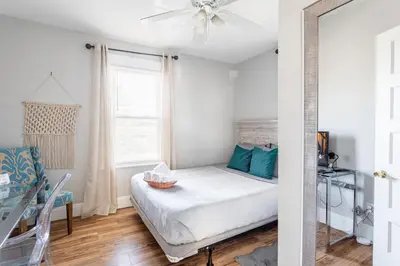 a small bedroom with a bed and a window at Sunny & Spacious 2BD 1BA WFH Apt-Huge Yard & Patio in Fairfield