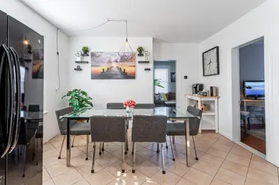 a dining room with a glass table and chairs at Sunny & Spacious 2BD 1BA WFH Apt-Huge Yard & Patio in Fairfield
