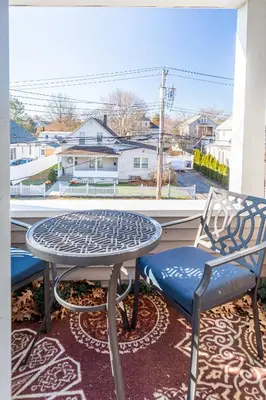 a table and chairs on a balcony with a view at Sunny & Spacious 2BD 1BA WFH Apt-Huge Yard & Patio in Fairfield