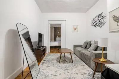 a living room with a couch and a table at 89-2R 1BR Upper East Side in New York