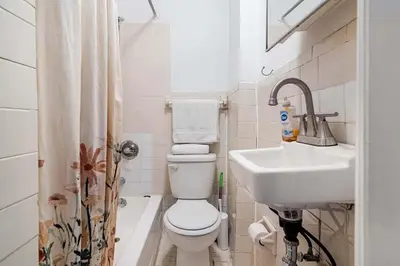 a bathroom with a toilet and a sink at 89-2R 1BR Upper East Side in New York