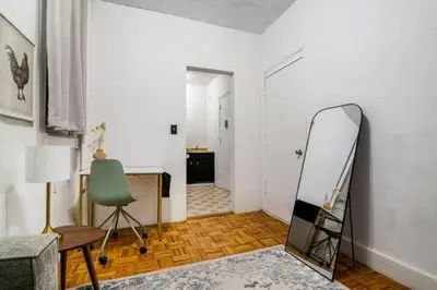 a room with a mirror and a desk and a chair at 89-2R 1BR Upper East Side in New York
