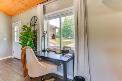 a home office with a desk and a window at Delaware River Access Peaceful Farm Retreat! in Callicoon