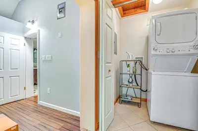 a kitchen with a washer and dryer at Charming Ballston Spa Home with Sauna and Private Pool in Ballston Spa
