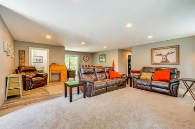 a living room with leather furniture and a table at Wilmington Retreat Near Trails, Skiing and Festivals in Wilmington
