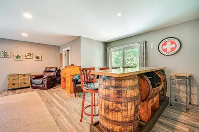 a living room with a large wine barrel at Wilmington Retreat Near Trails, Skiing and Festivals in Wilmington