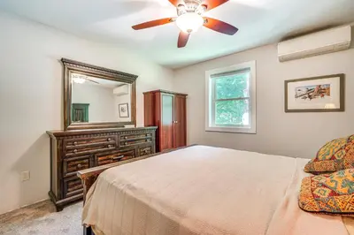 a bedroom with a bed and a ceiling fan at Wilmington Retreat Near Trails, Skiing and Festivals in Wilmington