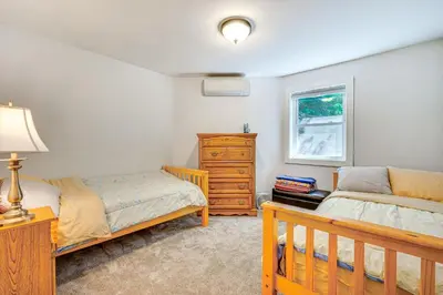 a bedroom with two beds and a dresser at Wilmington Retreat Near Trails, Skiing and Festivals in Wilmington