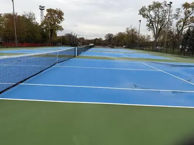 a row of tennis courts on a tennis court at NatureGlow Residence Stylish Contemporary Home in Harwinton