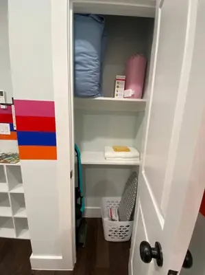 a closet with a door open to a room at Heart of NY - 17 min to Empire State & Times Sq in Jersey City