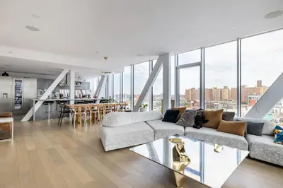 a living room with a couch and a table at Travive New York Brand New Five Bedroom Penthouse in New York
