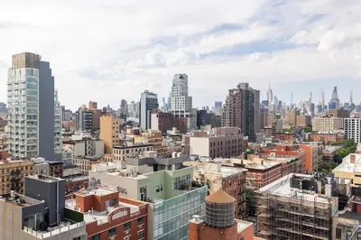 an aerial view of a city with tall buildings at Travive New York Brand New Five Bedroom Penthouse in New York