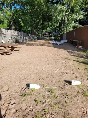 two white surfboards on the ground in a park at Lake Congamond Suffield House in Granby