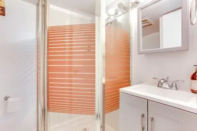 a bathroom with a shower and a sink at Convenient Apt 2 Mi to Sprain Ridge Park! in Yonkers