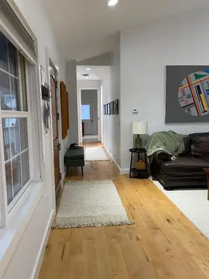 a living room with a couch and a window at Urban Peak Escape in Lenox