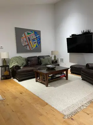 a living room with a couch and a coffee table at Urban Peak Escape in Lenox