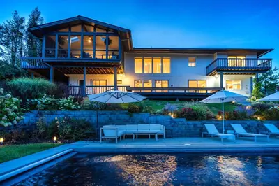 a house with a pool in front of it at Hudson House in Newburgh