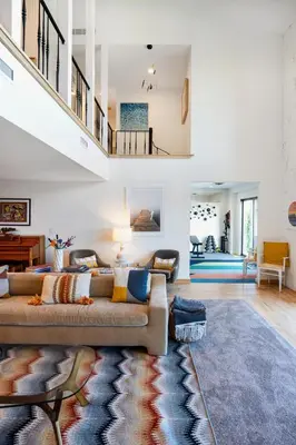 a living room with a couch and a rug at Hudson House in Newburgh