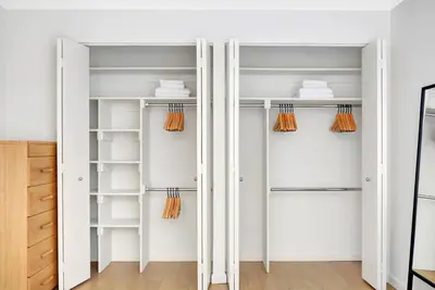 a walk in closet with white closets at UWS 1BR w Elevator Gym nr Central Park NYC-686 in New York