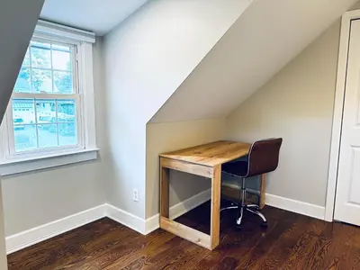 a desk in a room with a window and a chair at Norwalk Retreat in Norwalk