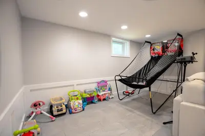 a childs room with a swing and toys at Norwalk Retreat in Norwalk