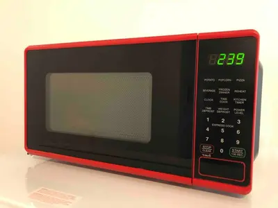 a red microwave oven sitting on top of a counter at Spacious 2-bedroom apartment with 1-bathroom and private street entrance, MetLife Stadium FIFA World Cup 25 minutes away in Paterson