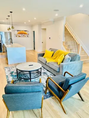 a living room with a couch and chairs and a table at Huge 2000 sqft Luxury & Stylish Condo minutes to New York in Jersey City