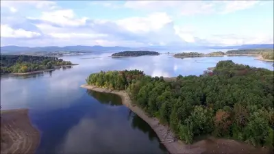 an aerial view of a large river with trees at Adirondack Spirit in Gloversville
