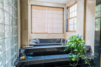 a bath tub in a bathroom with a plant at Private Gramercy TownHouse 3BR 3BA with Terrace in New York