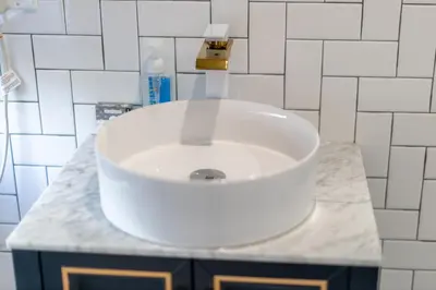 a bathroom with a white sink on a counter at Manhattan Bridge-Brooklyn-UN Private Suite Bath in Brooklyn