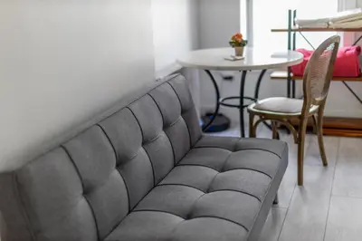 a living room with a couch and a table at Manhattan Bridge-Brooklyn-UN Private Suite Bath in Brooklyn