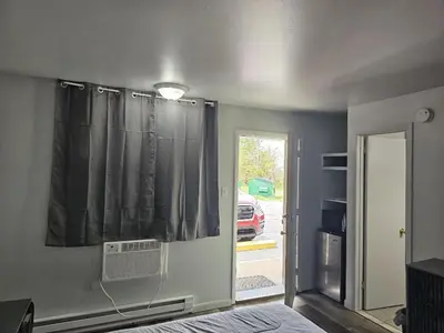 a room with a window with a air conditioner at Motel 81 in Dalton