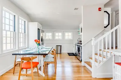a dining room with a table and chairs at 2BR Flat above Historic Cider Mill in Westport