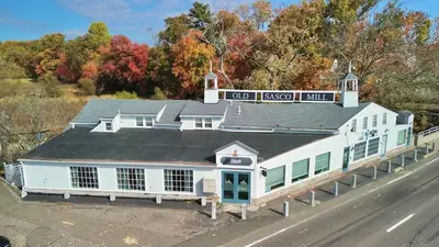 an overhead view of an old fashioned inn on the side of a road at 2BR Flat above Historic Cider Mill in Westport