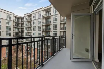 a balcony with a door leading to a building at Luxury Apt In Harbor Point with Balcony in Stamford