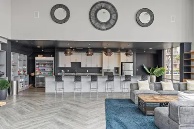 a living room with a bar and a kitchen at Luxury Apt In Harbor Point with Balcony in Stamford