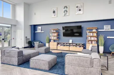 a living room with couches and a flat screen tv at Luxury Apt In Harbor Point with Balcony in Stamford