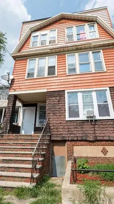 a house with a staircase leading up to it at New Apartment Liberty State Park Jersey City NJ Airport Train Manhattan NYC in Jersey City