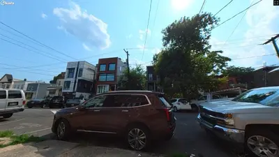 a car parked on the side of a city street at New Apartment Liberty State Park Jersey City NJ Airport Train Manhattan NYC in Jersey City