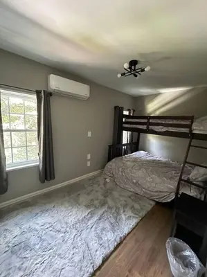 a bedroom with a bed and a ceiling fan at 3BR, 2BA and Office Fire Pit,Mins 2 UConn & Lake in Coventry
