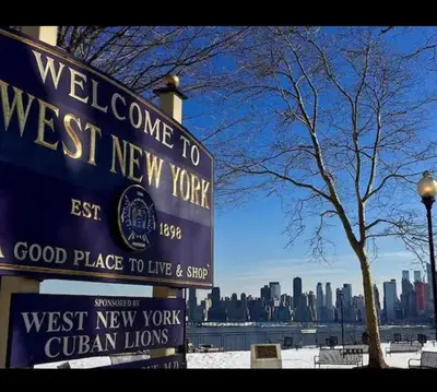a sign for a west new york sign with a city at Private Room A-KING BED-12Mints NYCity Times Square in West New York