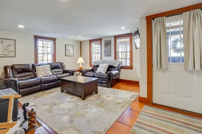 a living room with leather furniture and a door at Walk to Memorial Park Pet-Friendly Bethlehem Home in Bethlehem