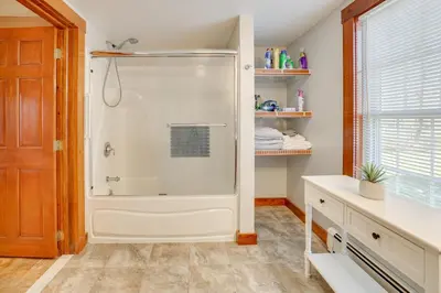 a white shower in a bathroom with a window at Walk to Memorial Park Pet-Friendly Bethlehem Home in Bethlehem
