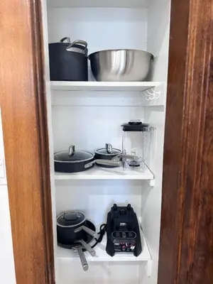 a shelf with pots and pans in a refrigerator at Modern and Cozy Pine Hills Home from Early 1900s in Albany