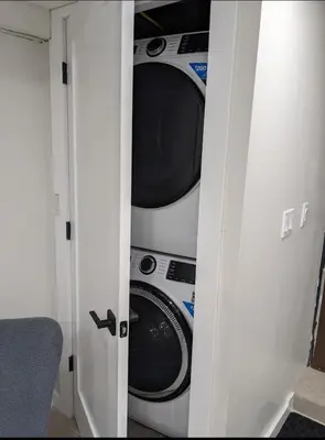 a kitchen with a washer and dryer in a room at Extended Family Stay in Passaic